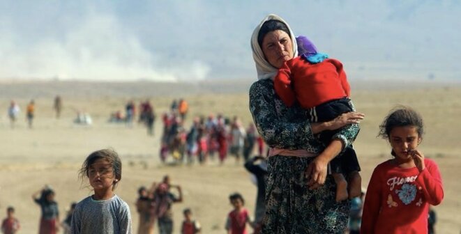 Yézidis chassés de leurs terres en Irak par les combattants de l'État islamique. © Reuters Yézidis chassés de leurs terres en Irak par les combattants de l'État islamique. © Reuters