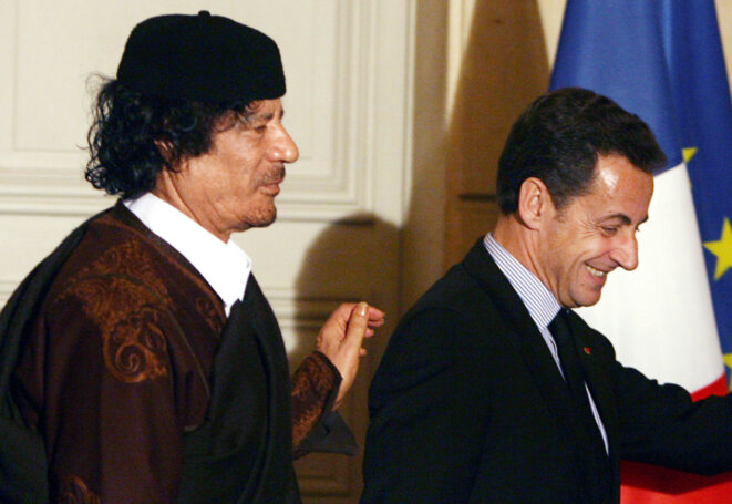 Muammar Gaddafi and Nicolas Sarkozy in Paris in December 2007. © Reuters Muammar Gaddafi and Nicolas Sarkozy in Paris in December 2007. © Reuters