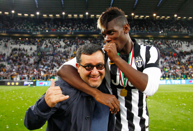 Paul Pogba with his agent Mino Raiola on the pitch of the Juventus Stadium, June 23rd 2015. © LaPresse - Spada Paul Pogba with his agent Mino Raiola on the pitch of the Juventus Stadium, June 23rd 2015. © LaPresse - Spada