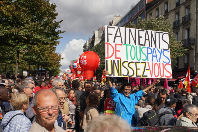 « Fainéants » : le mot était partout dans le cortège. © AP « Fainéants » : le mot était partout dans le cortège. © AP