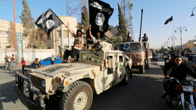 Parade de l'État islamique dans les rues de Raqqa, en Syrie, le 30 juin 2014. © Reuters Parade de l'État islamique dans les rues de Raqqa, en Syrie, le 30 juin 2014. © Reuters