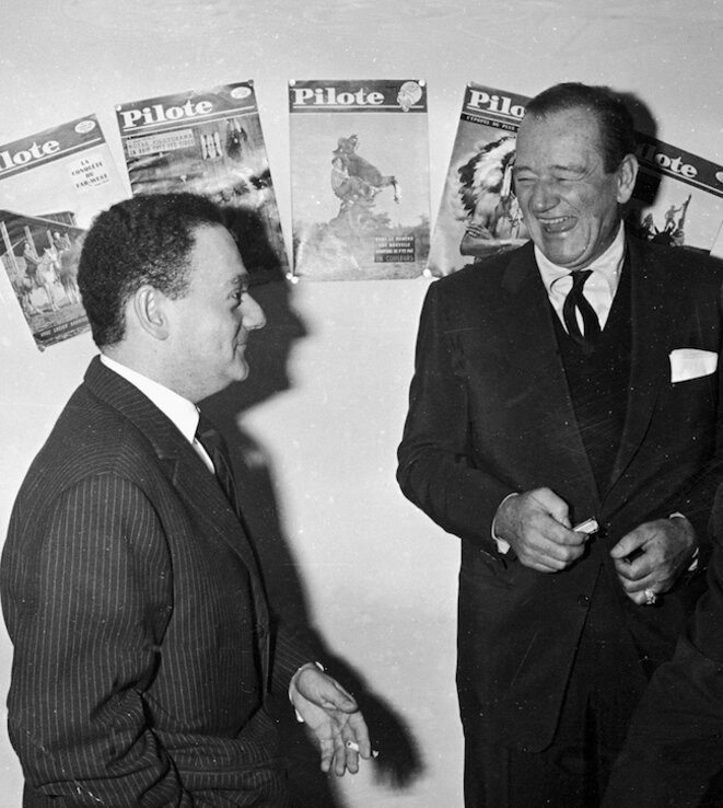 René Goscinny et John Wayne dans les bureaux de Pilote, publiée dans Pilote n° 58, 1er décembre 1960 Crédit : Fonds d’archives Institut René Goscinny © Droits réservés René Goscinny et John Wayne dans les bureaux de Pilote, publiée dans Pilote n° 58, 1er décembre 1960 Crédit : Fonds d’archives Institut René Goscinny © Droits réservés