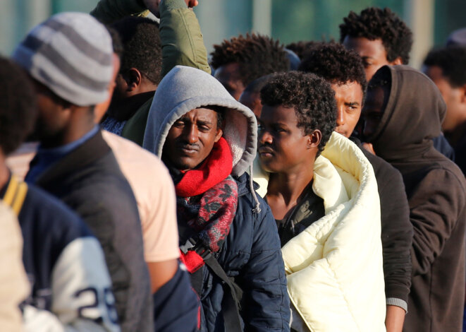 Des migrants d'Érythrée et d'Éthiopie, le 23 août 2017. © Reuters / Pascal Rossignol. Des migrants d'Érythrée et d'Éthiopie, le 23 août 2017. © Reuters / Pascal Rossignol.