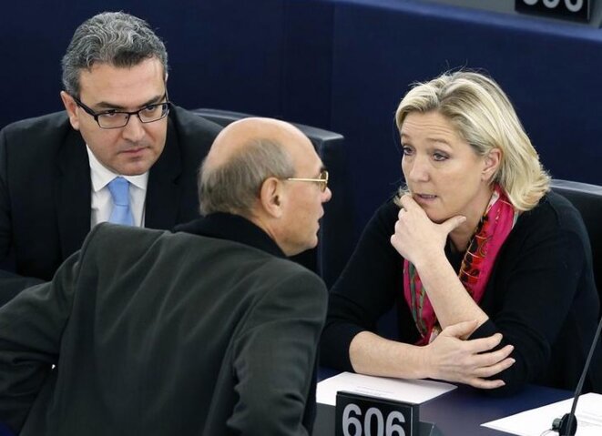 Marine Le Pen at the European Parliament on November 27th, 2014, with Aymeric Chauprade, left, and Jean-Luc Schaffhauser, two MEPs who played a key role in getting the Russian loans. © Reuters Marine Le Pen at the European Parliament on November 27th, 2014, with Aymeric Chauprade, left, and Jean-Luc Schaffhauser, two MEPs who played a key role in getting the Russian loans. © Reuters