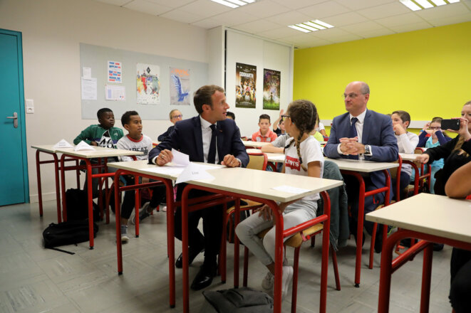 Jean-Michel Blanquer et Emmanuel Macron dans une école pour la rentrée scolaire. © Reuters