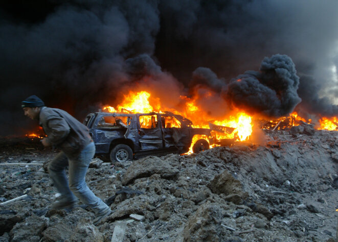 Le convoi en feu de Rafic Hariri, assassiné le 14 février 2005 dans un attentat à Beyrouth. © Reuters Le convoi en feu de Rafic Hariri, assassiné le 14 février 2005 dans un attentat à Beyrouth. © Reuters