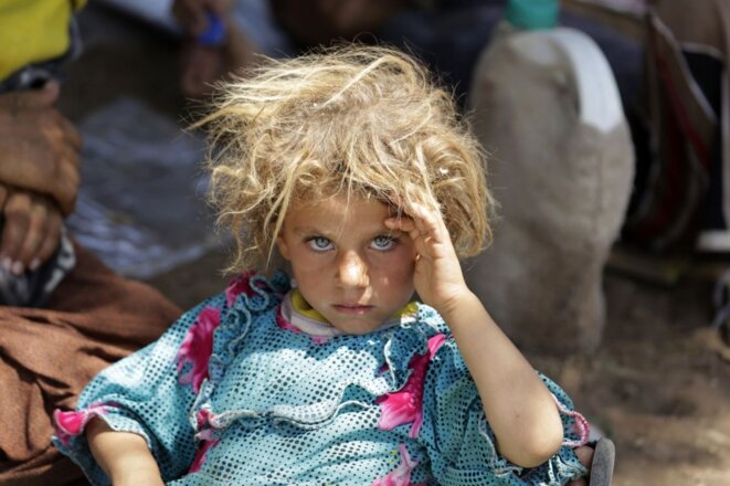 Une fillette de 6 ans, sur la route de l’exode en 2014. © Youssef Boudlal / Reuters Une fillette de 6 ans, sur la route de l’exode en 2014. © Youssef Boudlal / Reuters