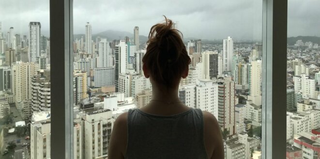 woman-standing-near-glass-window-763849-scaled-e1584293610381-1024x509