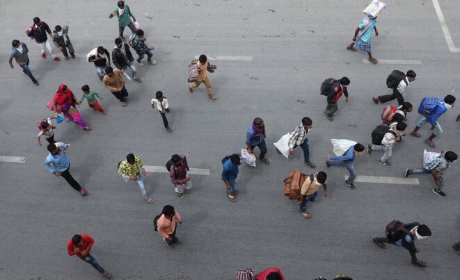 Migrant workers head towards a highway leading out of New Delhi, hoping to return to their home villages © Rajat Gupta - EPA/EFE - Shutterstock Migrant workers head towards a highway leading out of New Delhi, hoping to return to their home villages © Rajat Gupta - EPA/EFE - Shutterstock