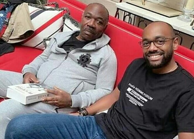 Ali Bongo dans son manoir londonien en compagnie de Noureddin : le sourire carnassier du "fils" qui a déjà enterré son père Ali Bongo dans son manoir londonien en compagnie de Noureddin : le sourire carnassier du "fils" qui a déjà enterré son père
