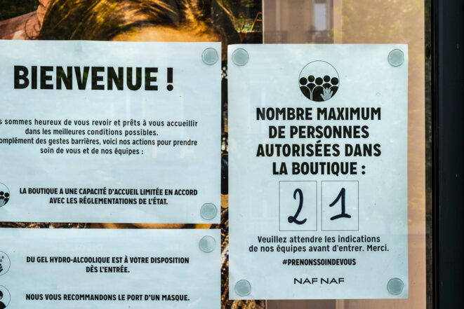 Un magasin parisien fixe les règles d'entrée. © AFP Un magasin parisien fixe les règles d'entrée. © AFP