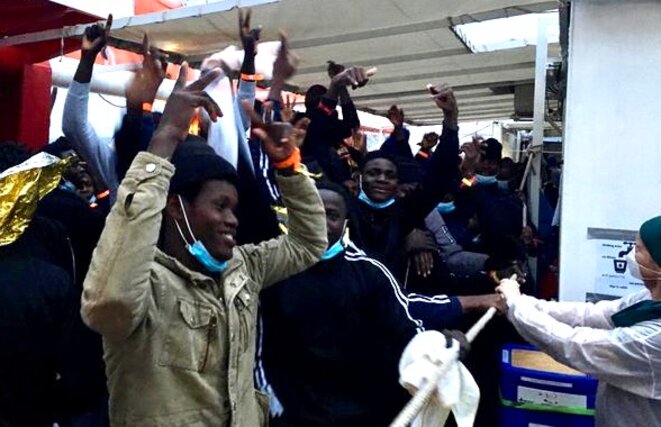 Migrants aboard the Ocean Viking celebrate the news after permission was granted to dock in Italy. © NB