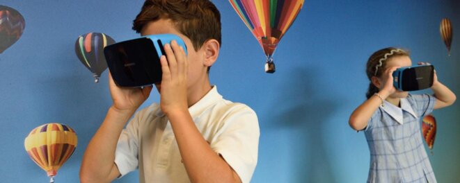 two-children-wearing-virtual-headsets