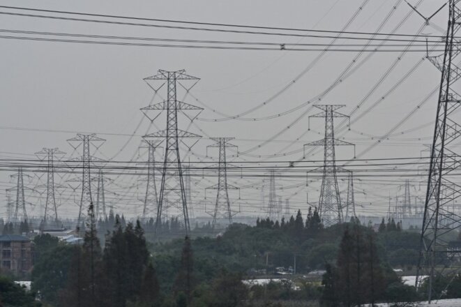 Lignes à haute tension à Shanghai © Hector Retamal / AFP Lignes à haute tension à Shanghai © Hector Retamal / AFP