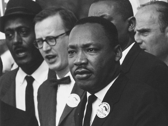 The Rev. Dr. Martin Luther King Jr. in a crowd at the Civil Rights March on Washington, D.C. in 1963. © National Archives Record #542015 – Public Domain