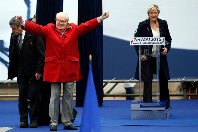 Jean-Marie et Marine Le Pen le 1er mai 2015 à Paris. © Photo Kenzo Tribouillard / AFP