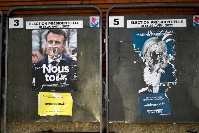 Election posters of Emmanuel Macron and Marine Le Pen in Paris, April 2022. © Photo Magali Cohen / Hans Lucas via AFP