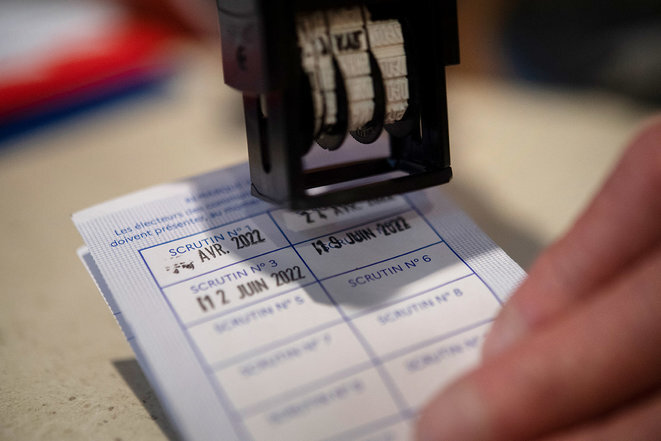 A voting card is stamped after a vote in the second round of the legislative elections at Carhaix-Plouguer in Brittany, June 19th 2022. © Photo Fred Tanneau / AFP