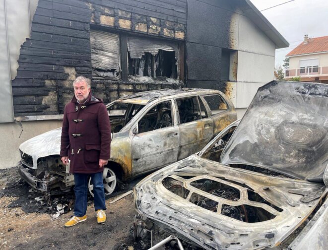 Yannick Morez, mayor of Saint-Brevin-les-Pins, pictured on March 22nd in front of his damaged home and burnt-out cars following an arson attack. © Photo Ouest France / PhotoPQR via MaxPPP