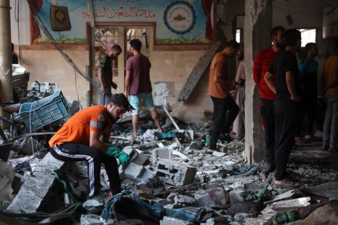 Dégâts dans l’école Al-Tabi'een, utilisée comme refuge pour les Palestiniens déplacés dans la ville de Gaza, après une frappe israélienne, le 10  août 2024. OMAR AL-QATTAA/AFP