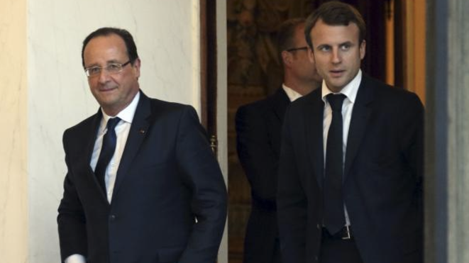 François Hollande et Emmanuel Macron, secrétaire général adjoint de l'Elysée. © Reuters François Hollande et Emmanuel Macron, secrétaire général adjoint de l'Elysée. © Reuters