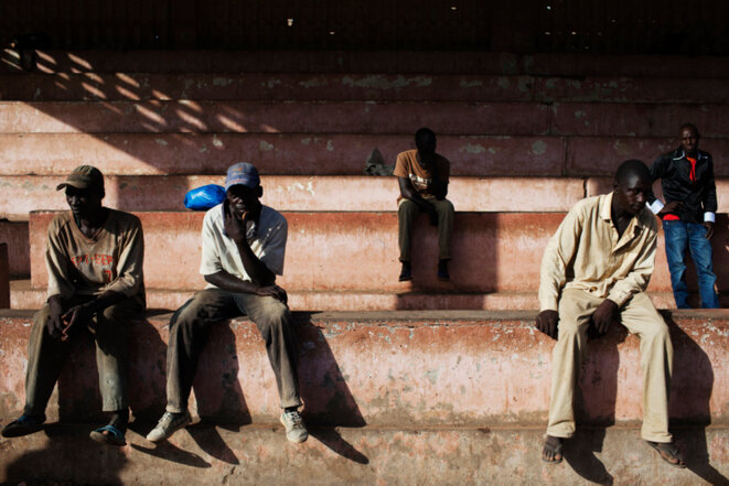 DATE IMPORTED:July 13, 2013Men sit before the start of a campaign rally for presidential candidate Ibrahim Boubacar Keita in Kayes July 13, 2013. Mali is due to hold presidential elections on July 28. REUTERS/Joe Penney (MALI - Tags: POLITICS ELECTIONS) © REUTERS/Joe Penney. DATE IMPORTED:July 13, 2013Men sit before the start of a campaign rally for presidential candidate Ibrahim Boubacar Keita in Kayes July 13, 2013. Mali is due to hold presidential elections on July 28. REUTERS/Joe Penney (MALI - Tags: POLITICS ELECTIONS) © REUTERS/Joe Penney.